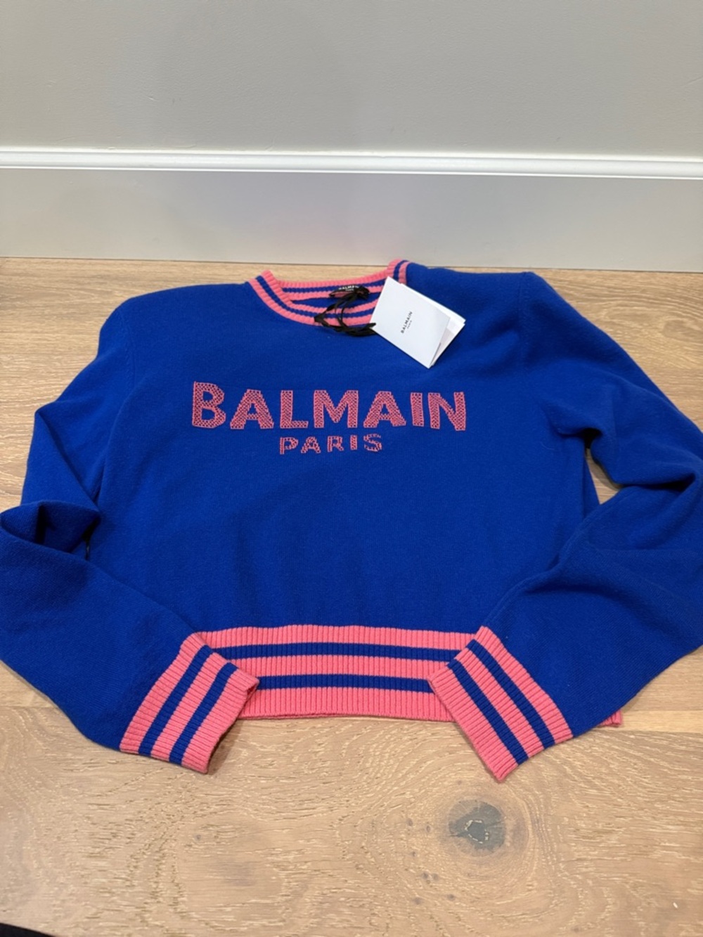 Brand new authentic Blue Crewneck Sweater with Pink Trim. Pls note hole in pic